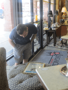 Shopper examining a framed item