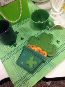St. Patrick's Day items including shamrock plate, pot of gold decoration, and mugs