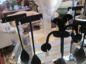 Earrings on black velvet display stands