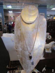 Silver chain necklace with black oval pendant