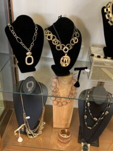 Assorted necklaces and jewelry on display busts