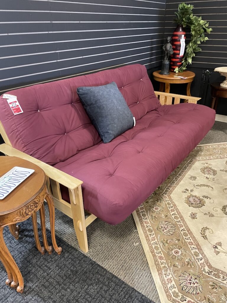 Wood-frame futon with burgundy mattress