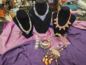 Vintage statement necklaces and bracelets on display